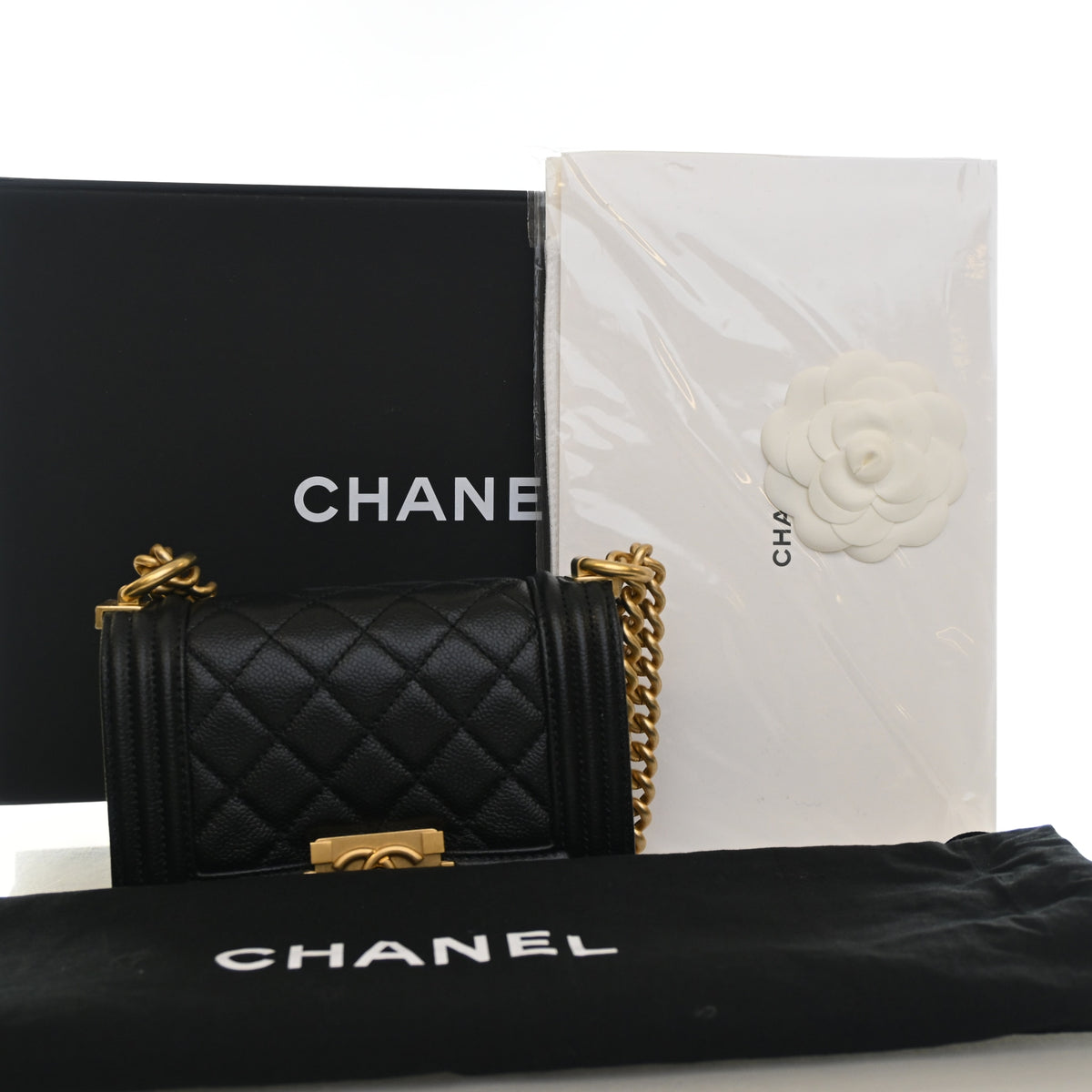 Pre-Owned Chanel Boy Bag Mini Caviar Leather, shown with dust bag and packaging
