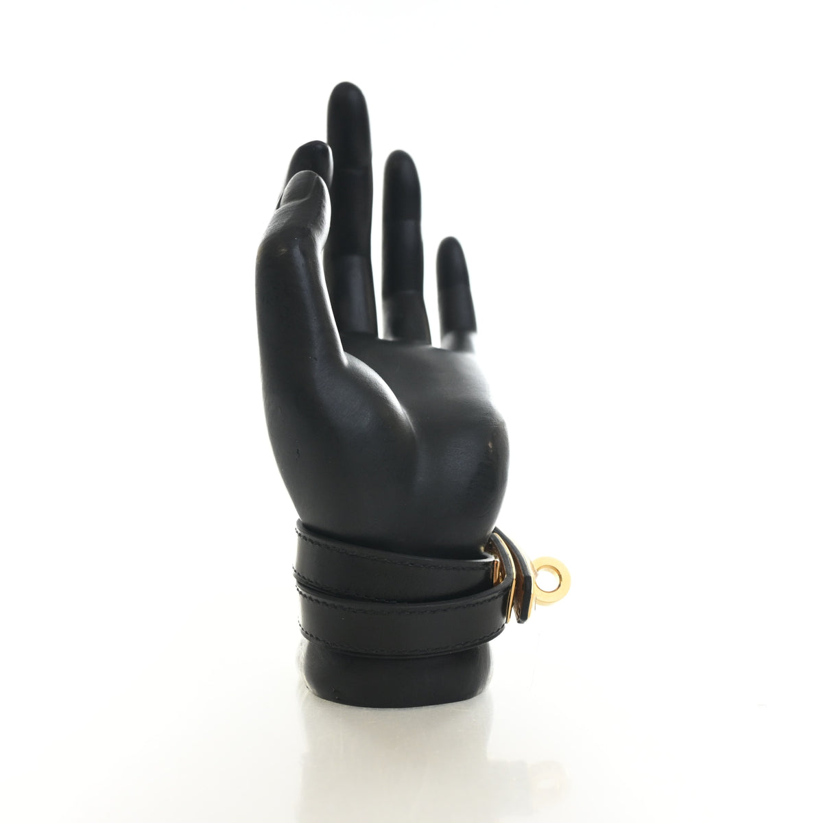 Pre-Owned Hermès Kelly Noir Swift Leather Double Tour Bracelet, held in hand