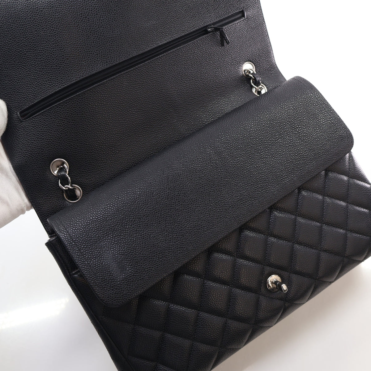 Pre-Owned Chanel Classic Double Flap Maxi Caviar Leather Bag, open interior with lining
