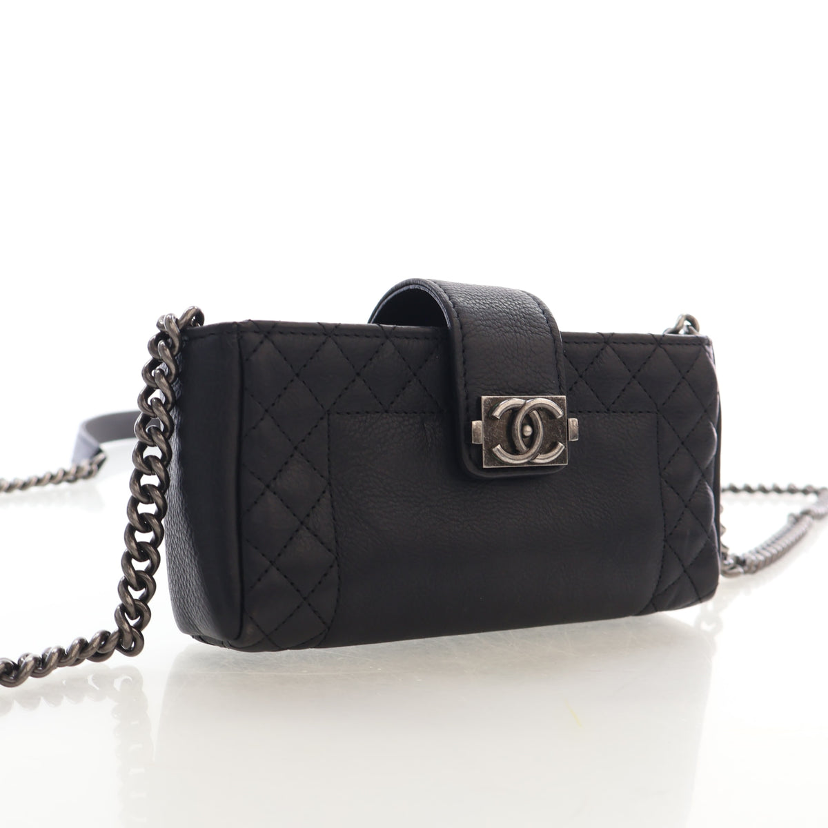 Pre-Owned Chanel Pochette Mini Calfskin Boy Reverso, three-quarter view, authenticated at Luxe Du Jour