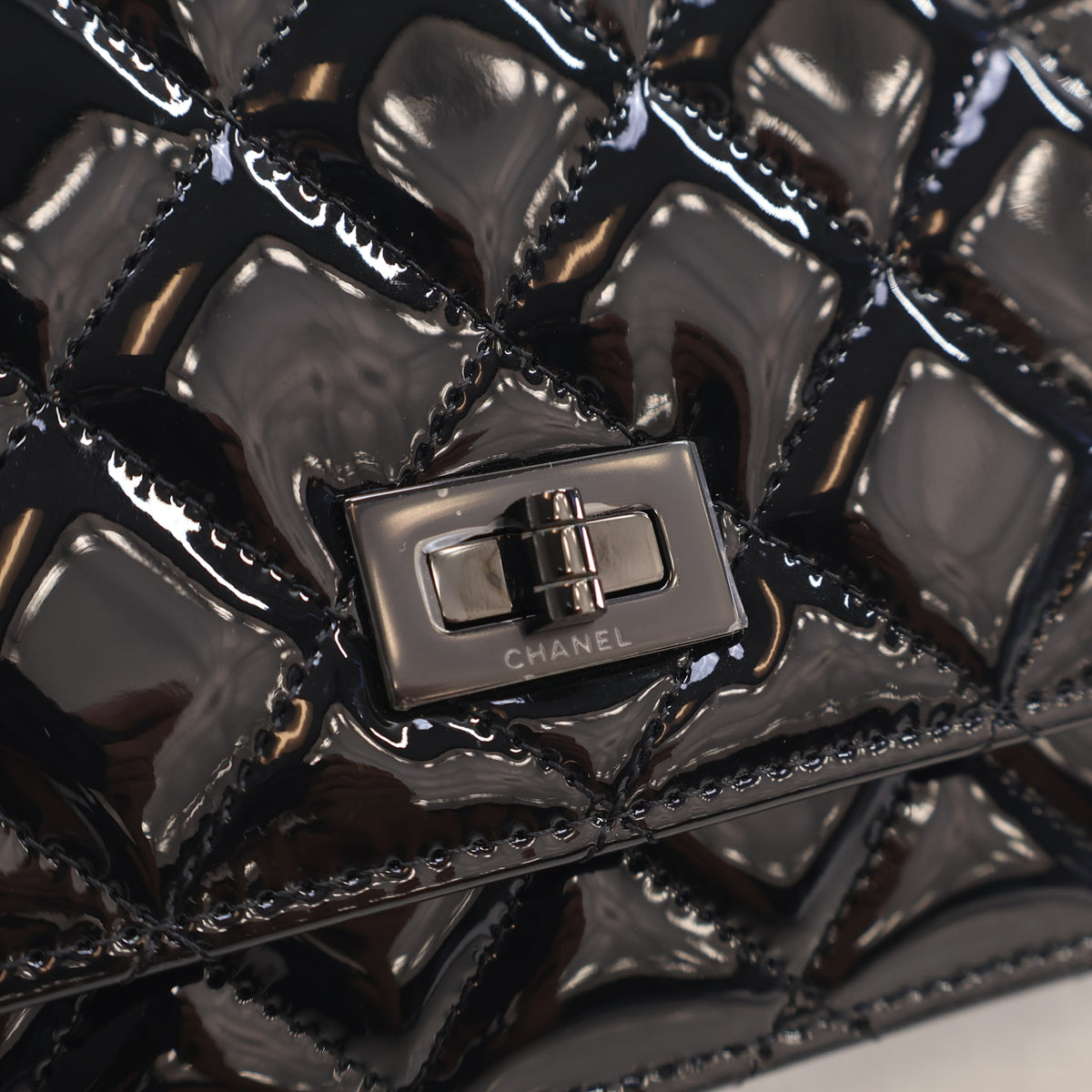 Pre-Owned Chanel Wallet On Chain Patent Leather Reissue 2.55 WOC, silver hardware close-up