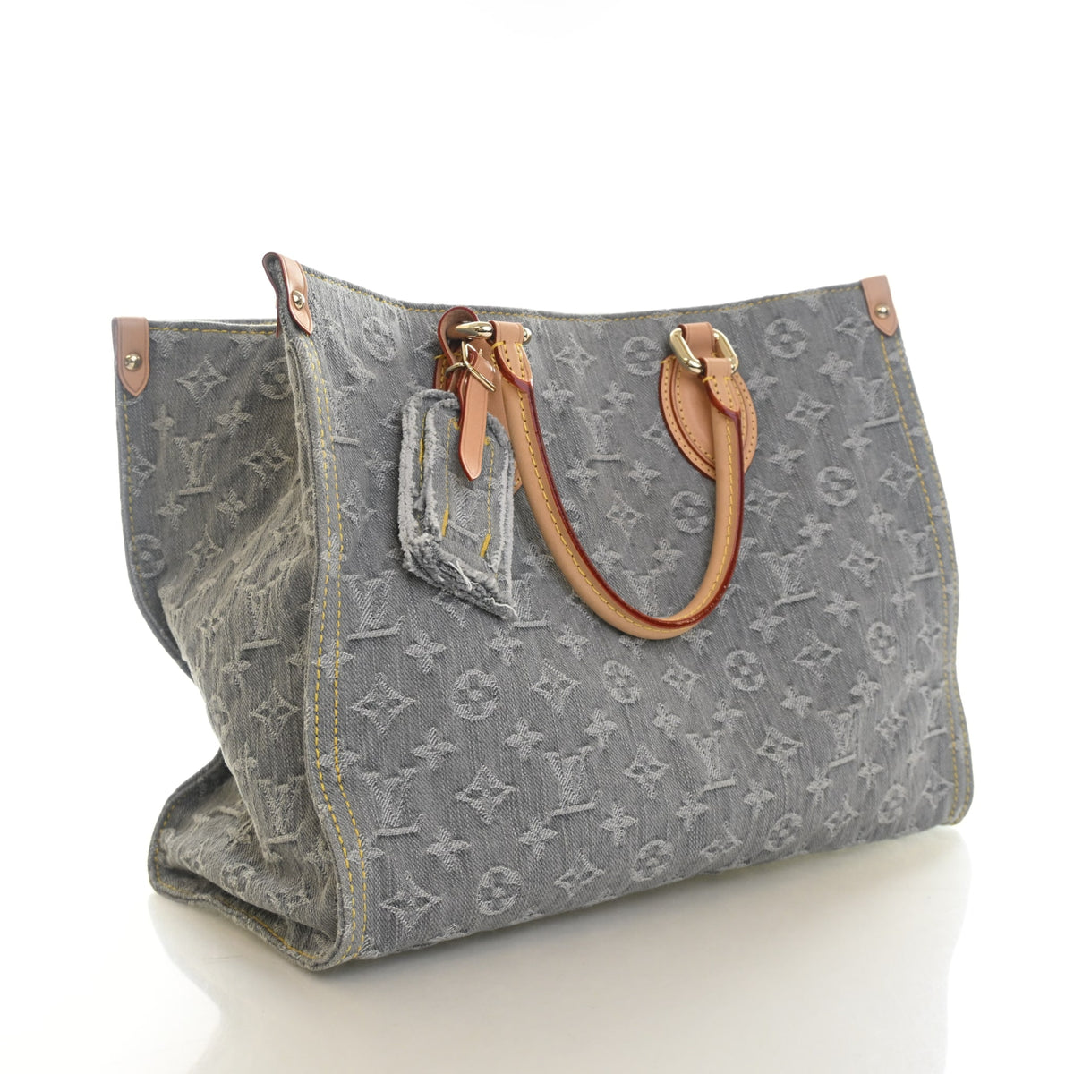 Pre-Owned Louis Vuitton Onthego MM Monogram Denim, three-quarter view, authenticated at Luxe Du Jour