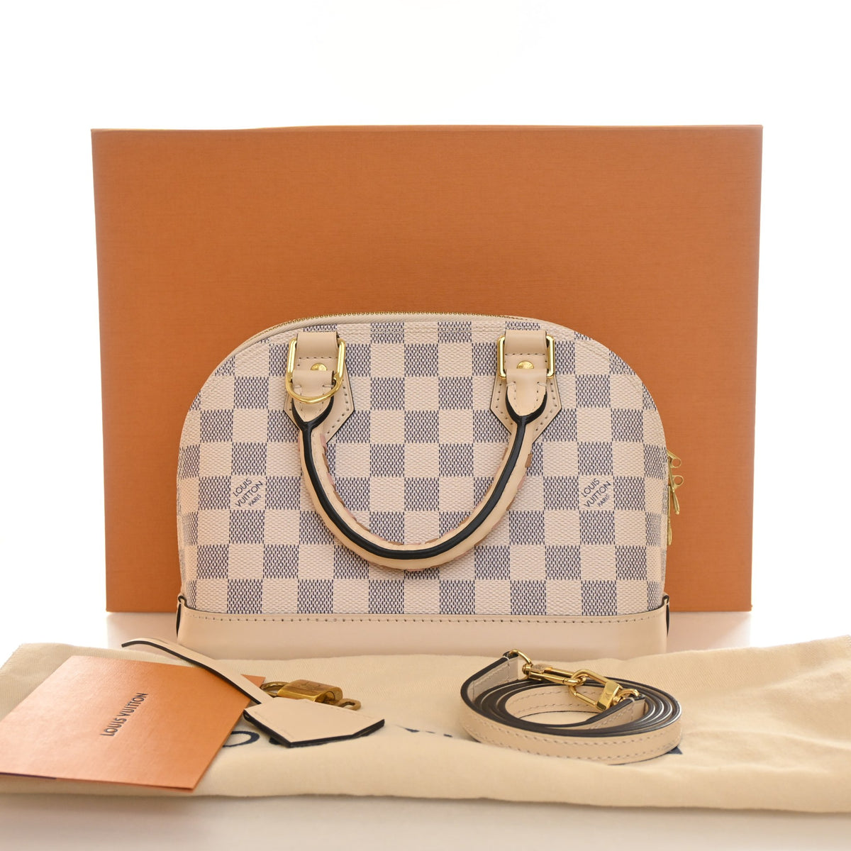 Pre-Owned Louis Vuitton Alma Damier Azur Braided BB, shown with dust bag and packaging