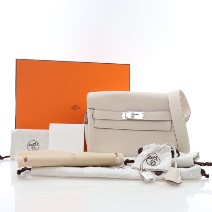 Pre-Owned Hermès Kelly Messenger PM Beton, shown with dust bag and packaging