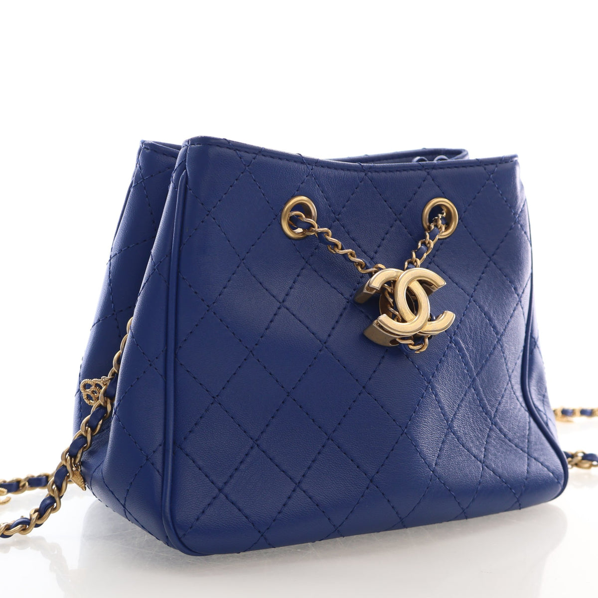 Pre-Owned Chanel Bucket Bag Mini Calfskin Egyptian Amulet Drawstring, three-quarter view, authenticated at Luxe Du Jour