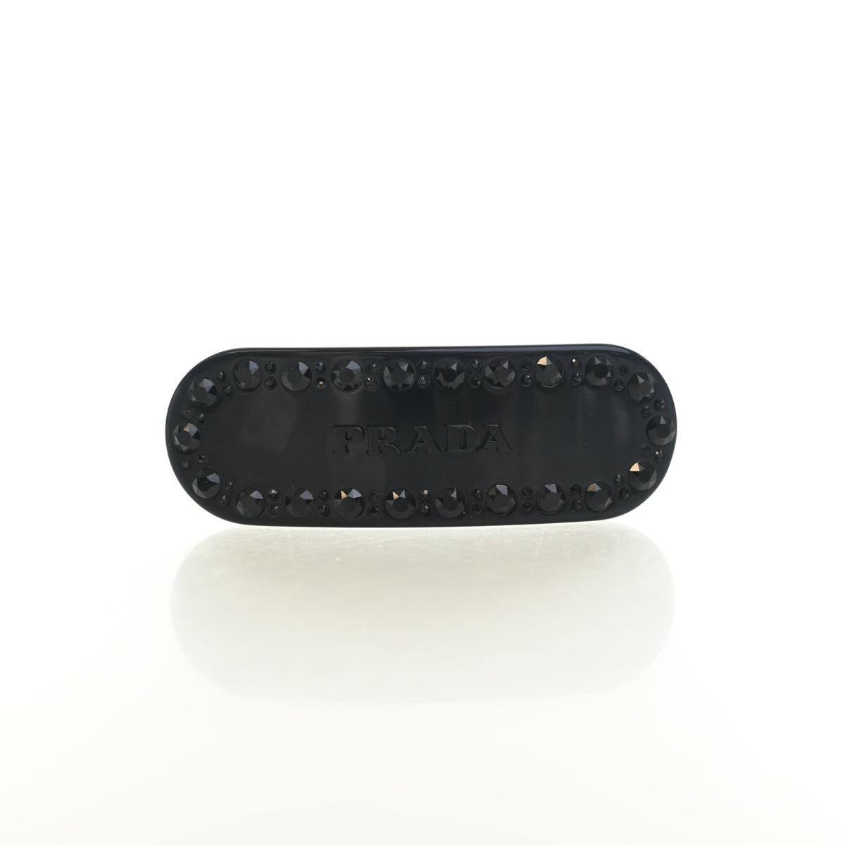 Pre-Owned Prada Crystal Logo Barrette, base and feet view, authenticated at Luxe Du Jour